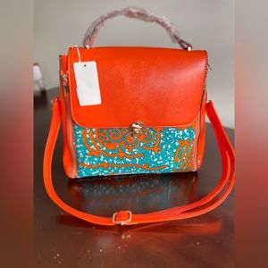 African print orange handbag
